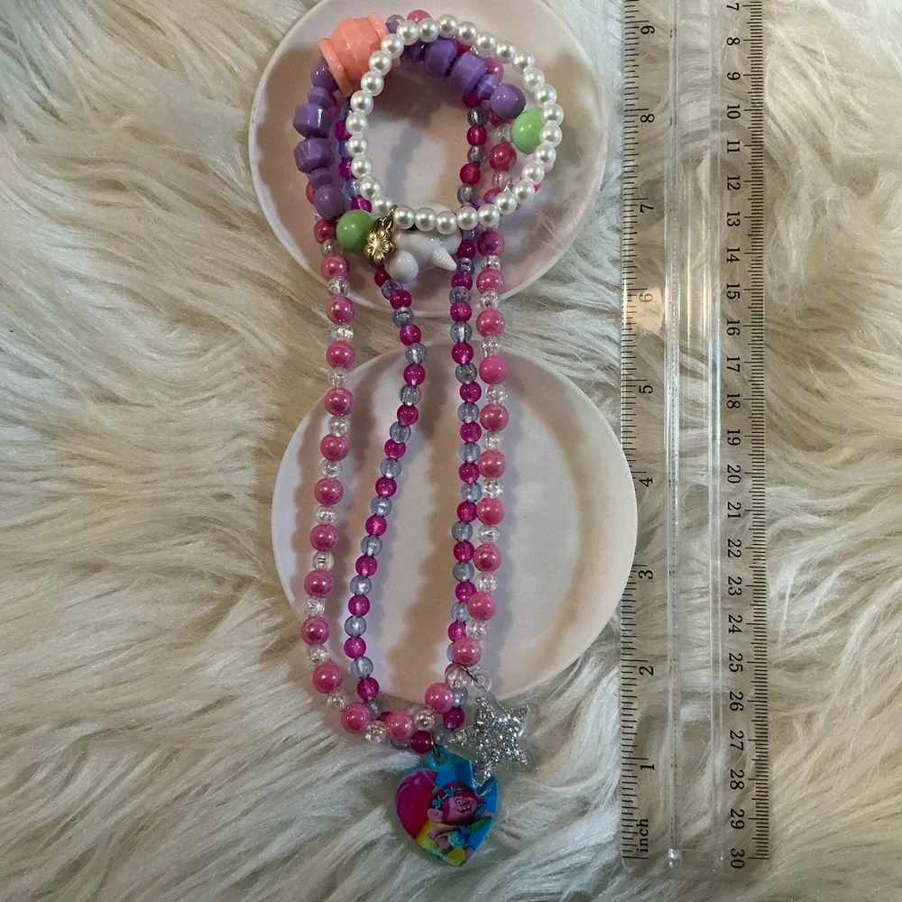 2 necklaces (one Dreamworks Trolls/Poppy) and 2 bracelets for children